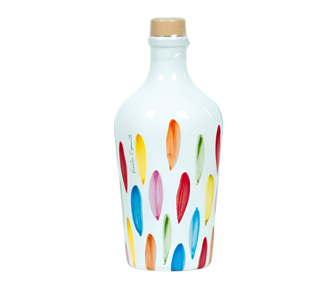 A white ceramic bottle with a cork stopper, decorated with a colorful pattern of vertical brushstroke-like shapes in red, yellow, blue, pink, orange, and green. The brand name 'Paparella' is printed vertically in black script on the left side.