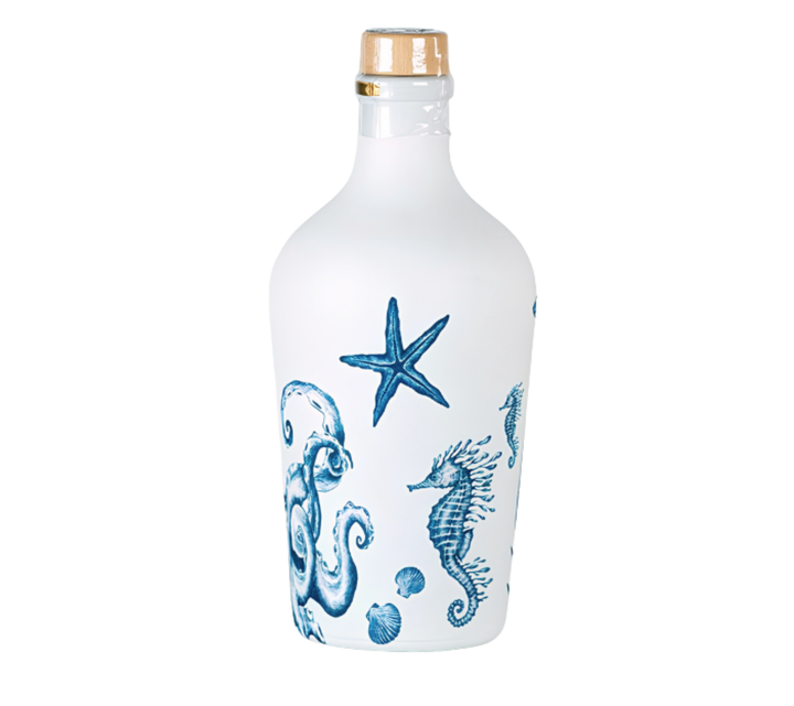 A frosted glass bottle with a gold screw cap, decorated with blue illustrations of a starfish, octopus, seahorse, and bubbles, shown against a plain white background.