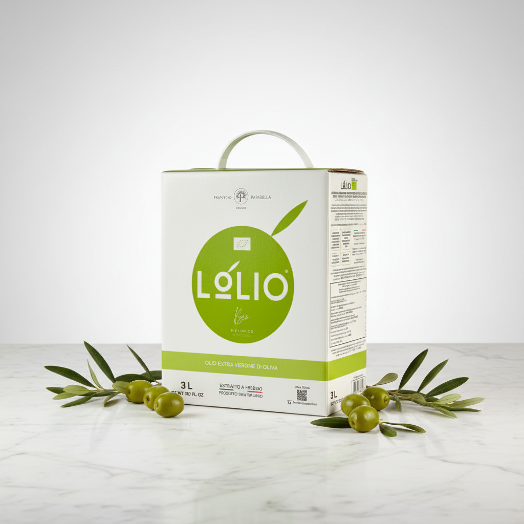 A 3-liter carton of Lolio extra virgin olive oil stands on a light marble surface with olive branches and green olives arranged around it. The carton is white with a large green oval logo and a white carry handle, photographed against a clean light gray studio background.