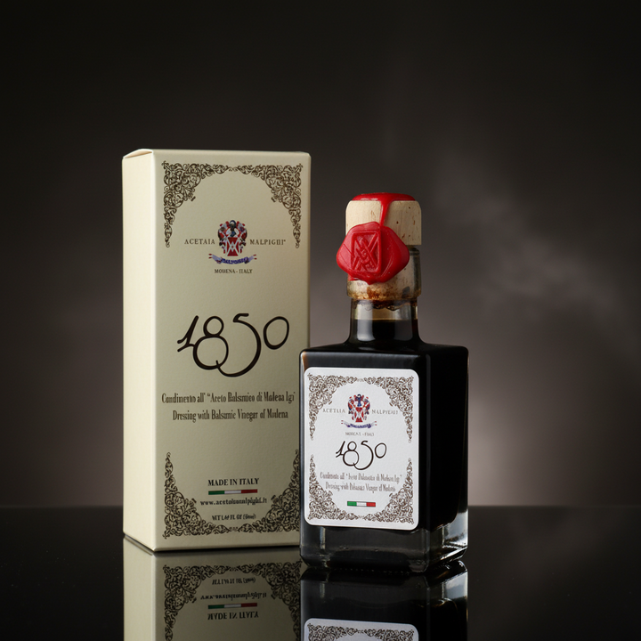 1850 Dressing with Balsamic Vinegar of Modena on a black background