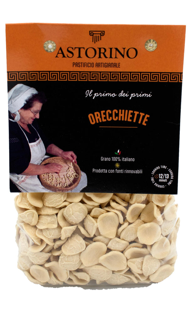 A package of Astorino Orecchiette pasta, showing the clear lower half filled with the pasta and the printed orange and black brand label on top.