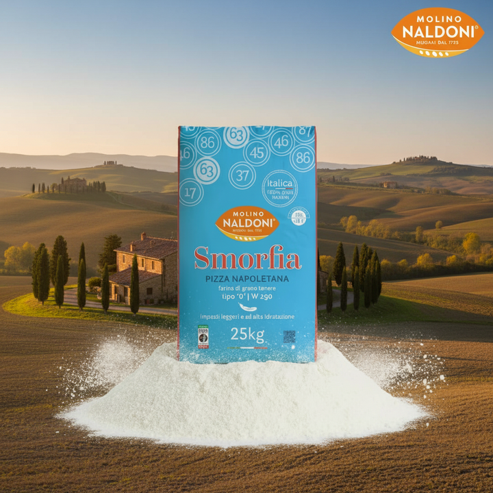 A 25kg box of Molino Naldoni Smorfia pizza napoletana stands upright on a pile of white flour against a scenic Tuscan landscape background with rolling hills, cypress trees, and a farmhouse.