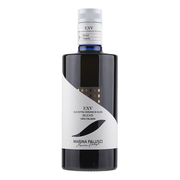 A bottle of Marina Palusci EXV Extra Virgin Olive Oil with a label showing the brand name and 'EXV' indicating extra virgin. The olive oil is presented in a dark glass container with a white and gold label.